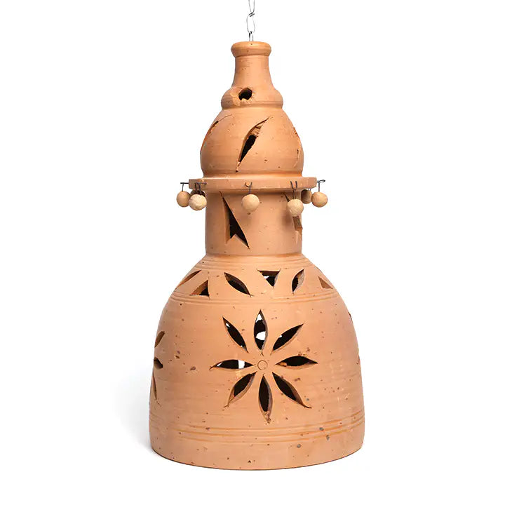 Handmade terracotta hanging lamp shell with floral cutouts side view