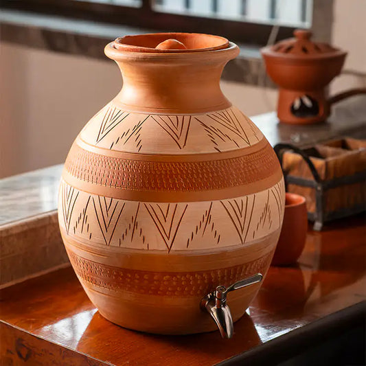 ClayNest handmade terracotta water matka with tap leaf motif lifestyle image