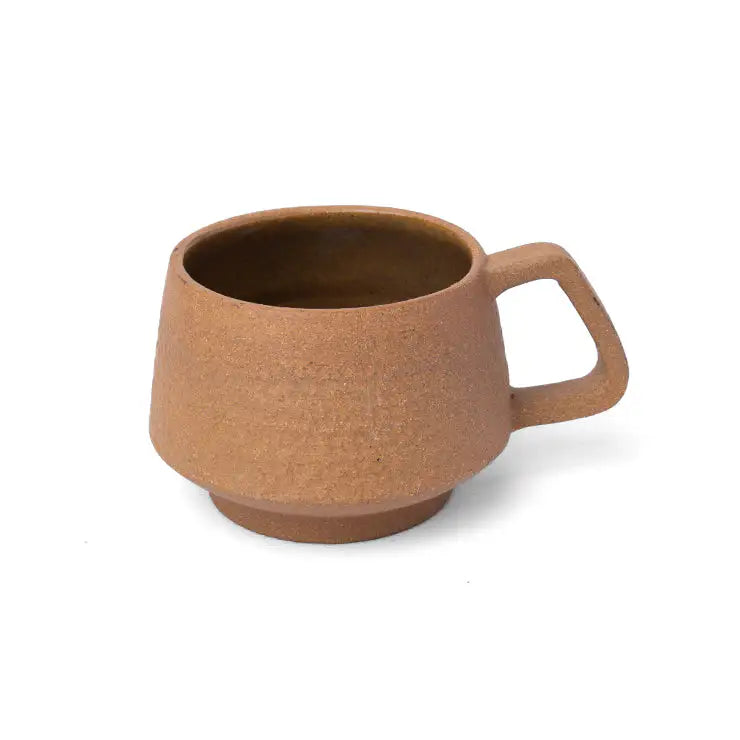 Handmade clay espresso cup with earth brown interior