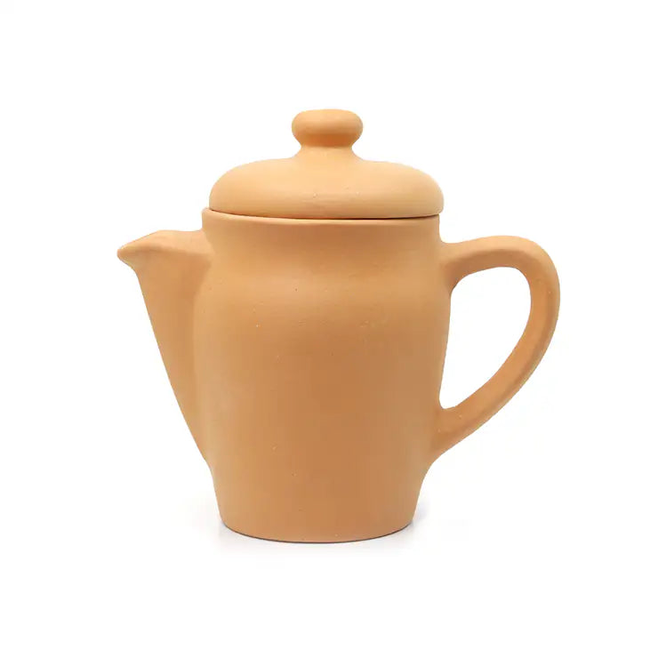 Terracotta teapot with lid on a white background