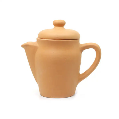 Terracotta teapot with lid on a white background