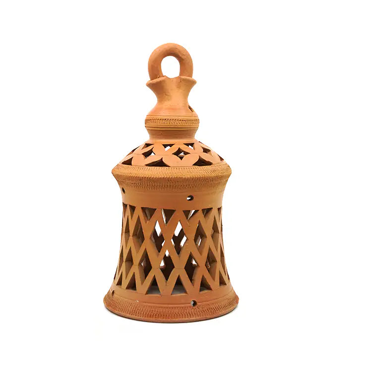 Terracotta lantern with intricate design on a white background