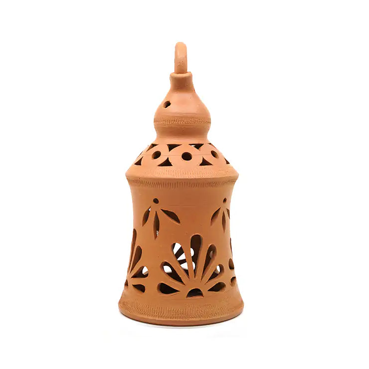 Terracotta lantern with decorative cutouts on a white background