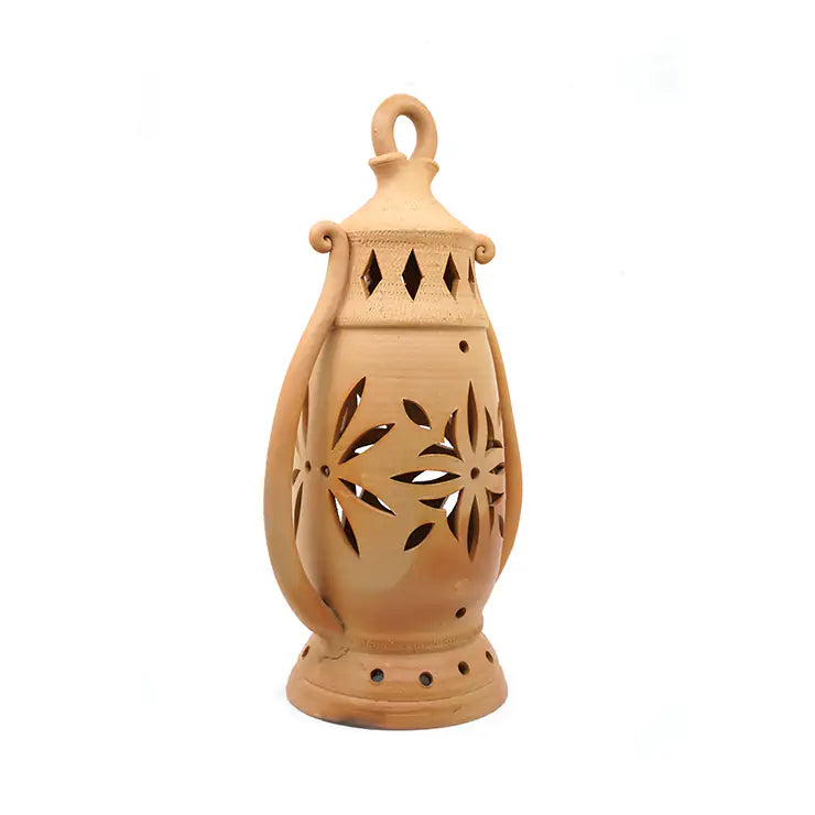 Terracotta lantern with decorative cutouts on a white background