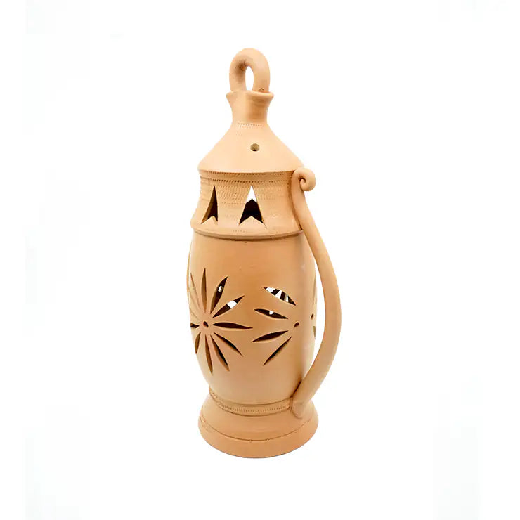 Beige ceramic lantern with decorative cutouts on a white background