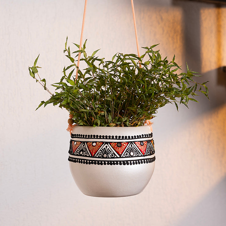 Maison Terracotta hanging planter in ivory white with hand-painted tribal band, suspended with rope cords
