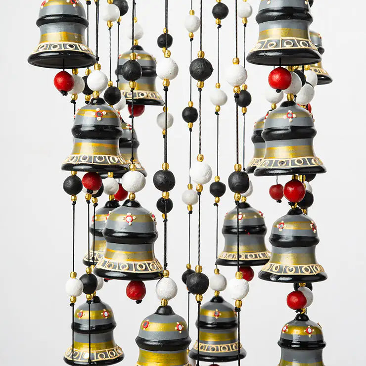 Decorative hanging bells with beads on a white background