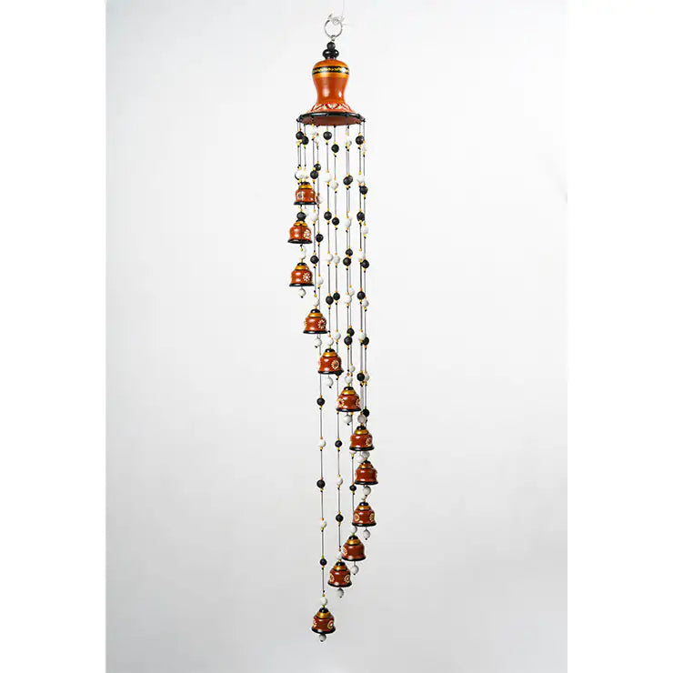 Decorative wind chime with hanging bells on a white background