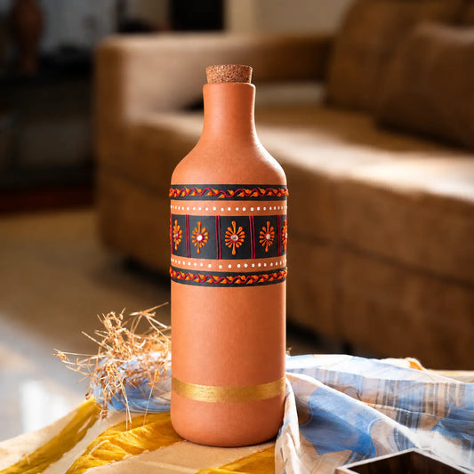 Hand-painted 1 liter clay water bottle from Maison Terracotta in home setting