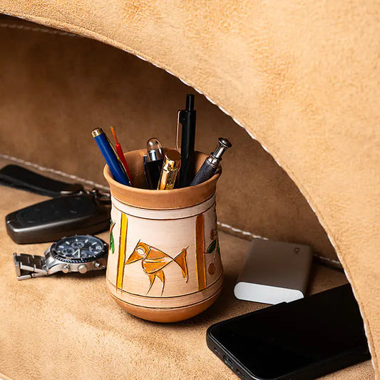 ClayNest handmade terracotta pen stand with hand-painted folk/tribal motif, compact desk organizer holding pens