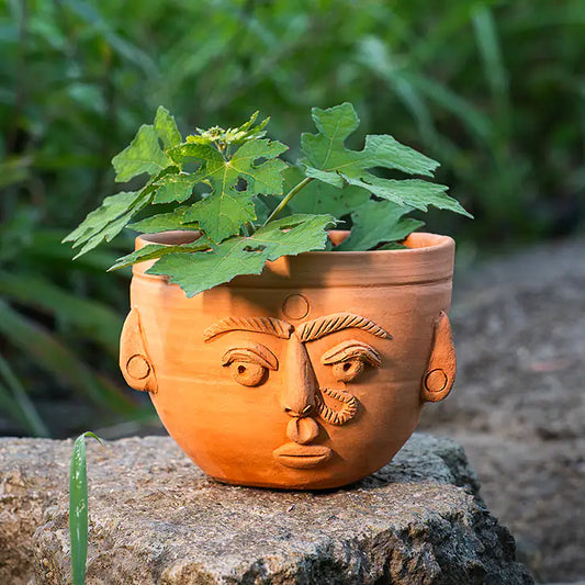Handmade ClayNest terracotta face planter with drainage hole, 10.5cm x 12.5cm