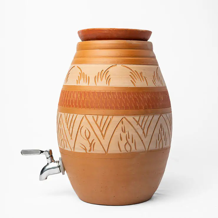 Clay water dispenser with decorative patterns on a white background