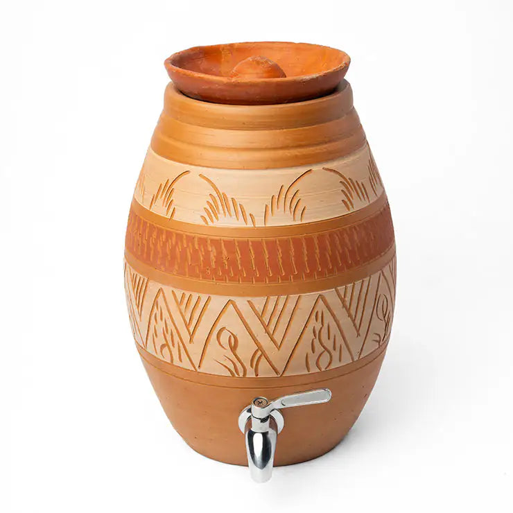 Clay water dispenser with decorative patterns on a white background