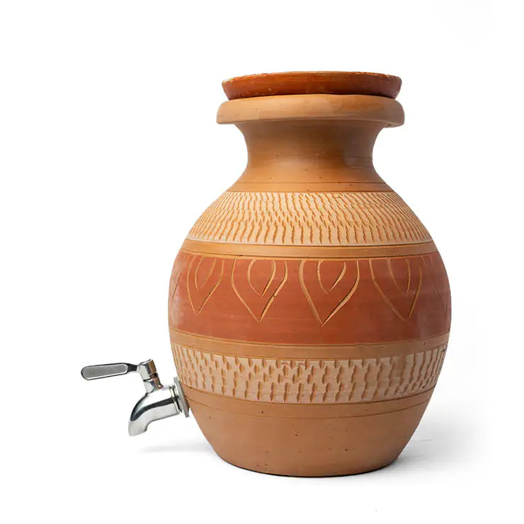 Clay water dispenser with decorative patterns on a white background