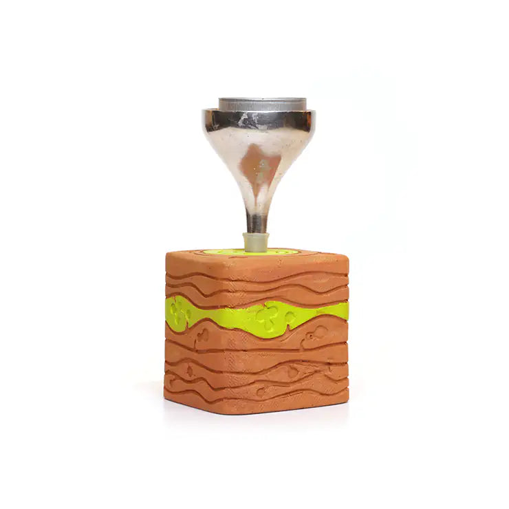 Terracotta candle light stand with green detail from ARK Naturals UAE