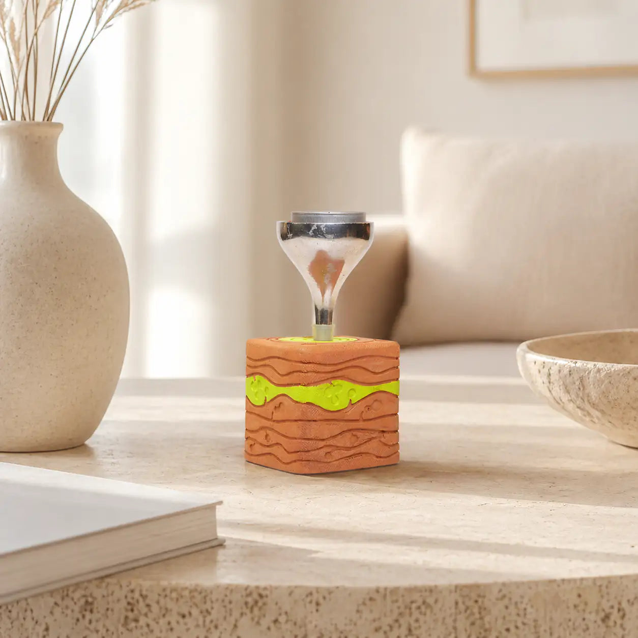 Handmade terracotta candle stand with green accent and glass tealight holder