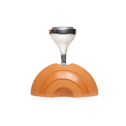 Half moon clay candle holder with carved arc detailing on white background