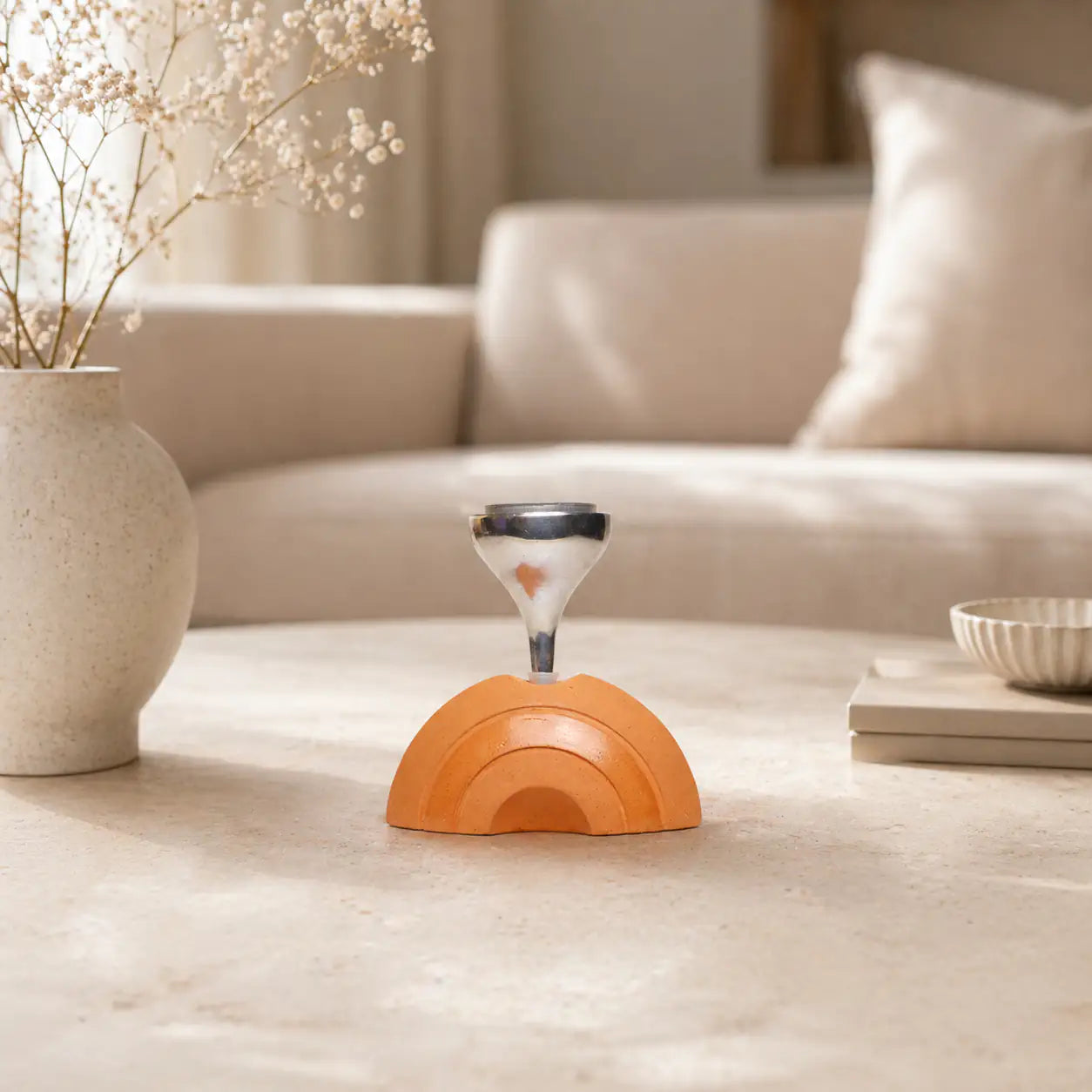 Amour Eclat terracotta candle stand styled on coffee table