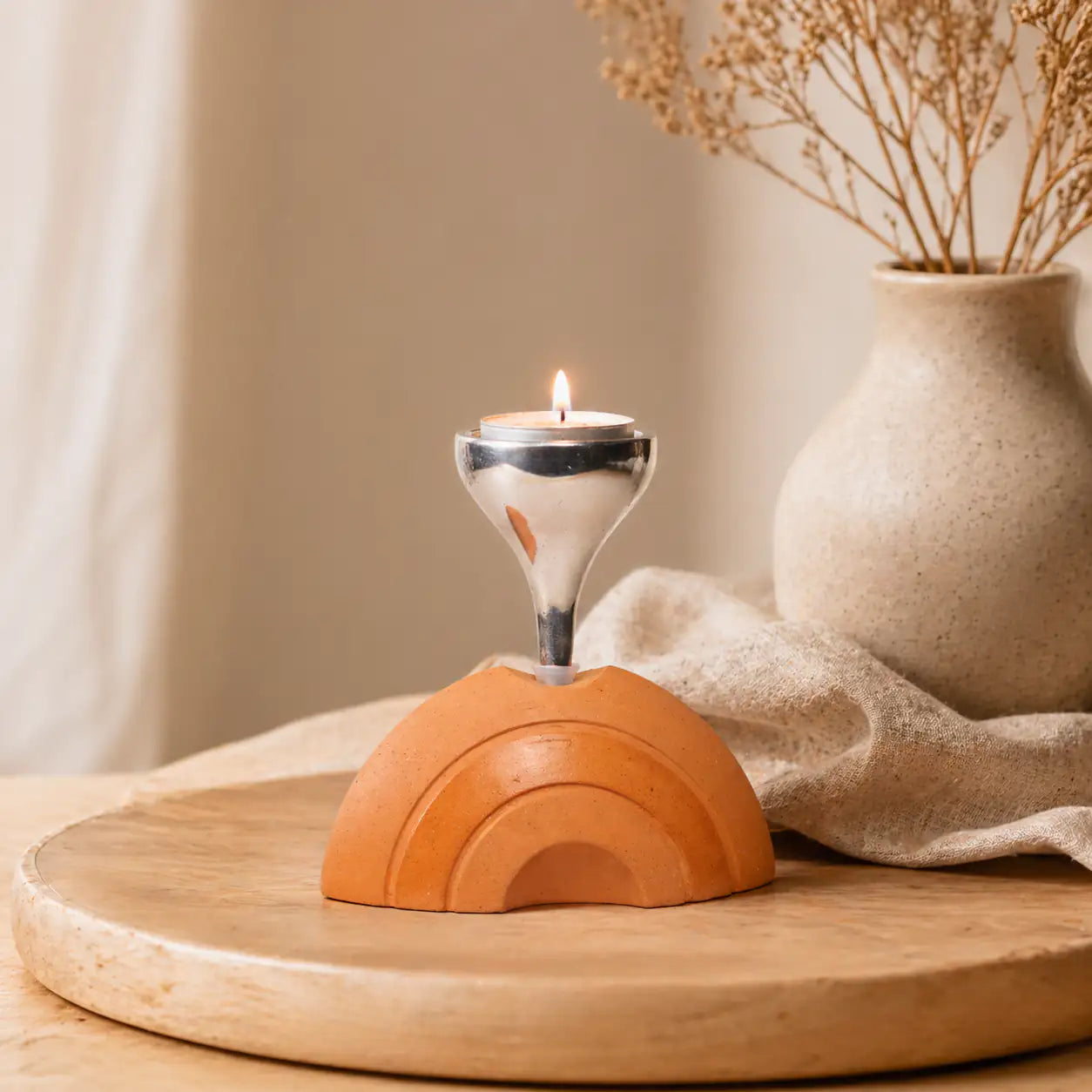 Handmade terracotta candle stand for warm home ambience