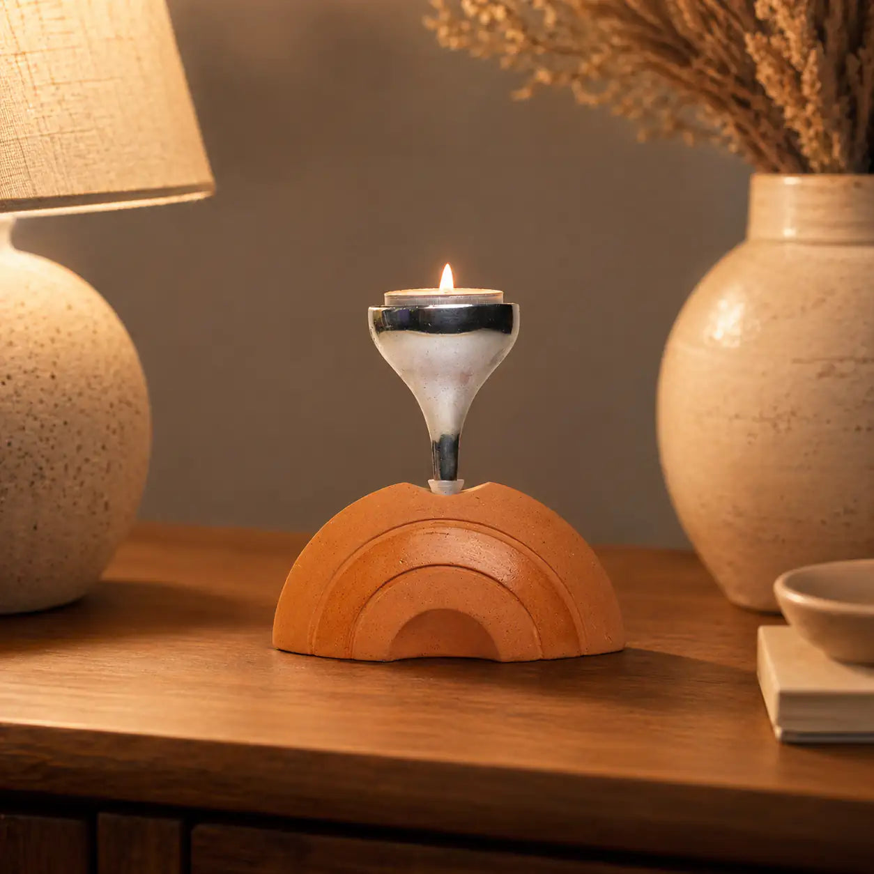 Amour Eclat terracotta candle stand styled on coffee table