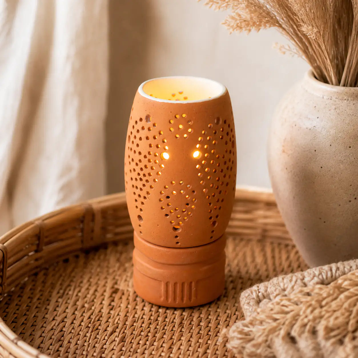 Amour Eclat terracotta candle holder styled on woven tray