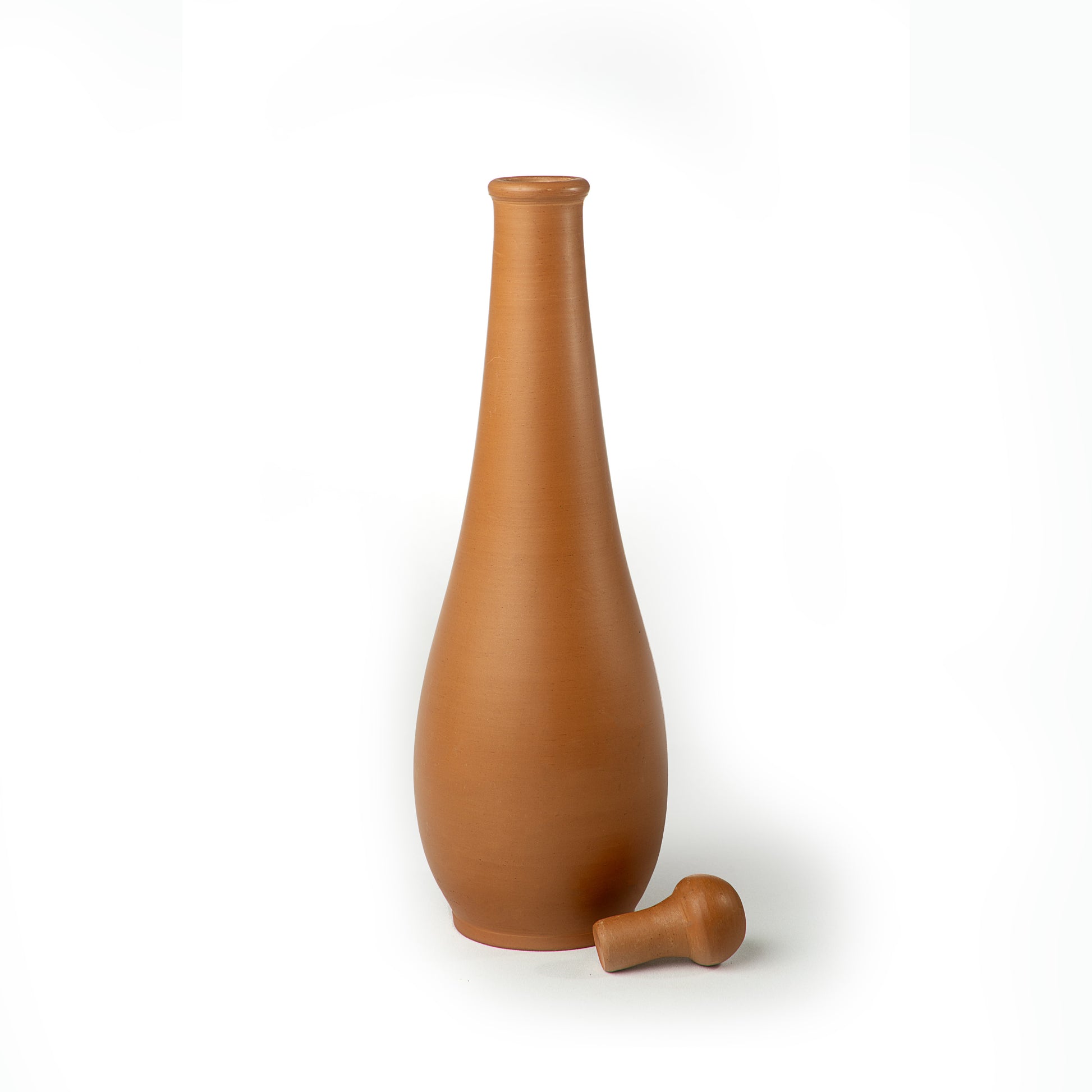 Crimson Noir handmade 1 litre terracotta water bottle with clay stopper beside it