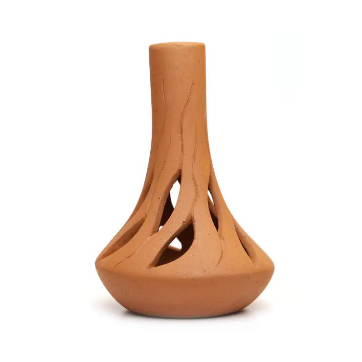 Handmade terracotta vase with sculptural root openwork design on white background