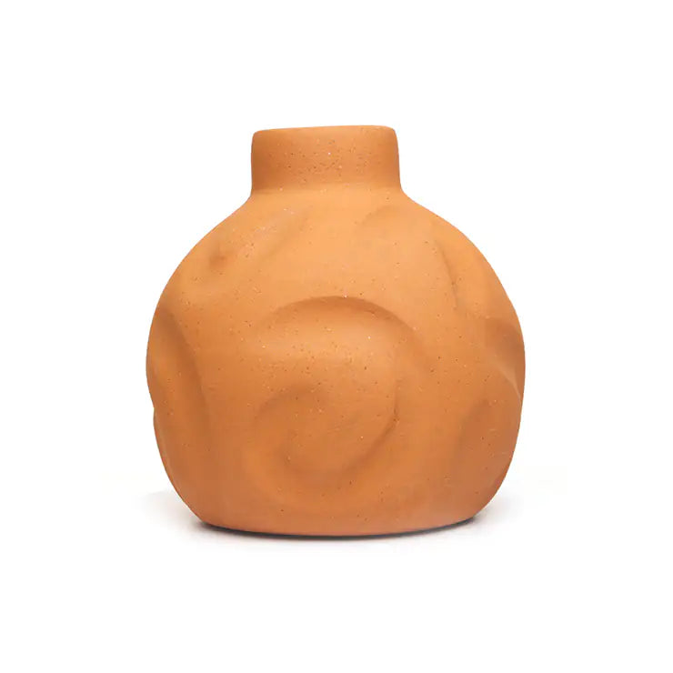 Terracotta vase with raised floral detailing on white background