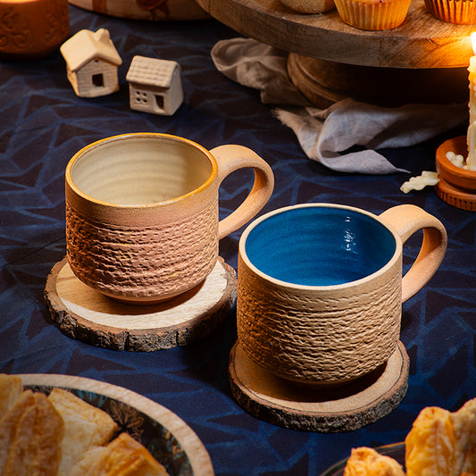 Terra Earthcore handmade terracotta mug (220ml) in two color variants. Textured earthy exterior with a smooth glazed-style interior feel—perfect for tea, coffee & karak