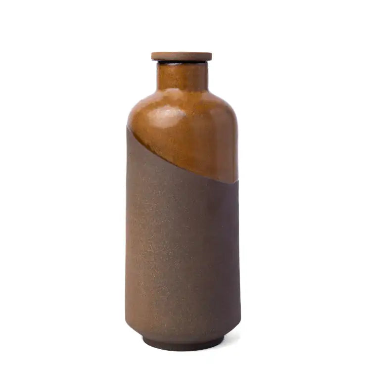 Two-toned ceramic vase with brown and gray gradient on a white background