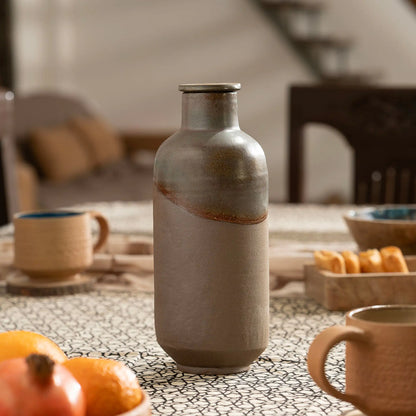 Terra Earthcore 1000 ml handmade terracotta water bottle in modern dining setting