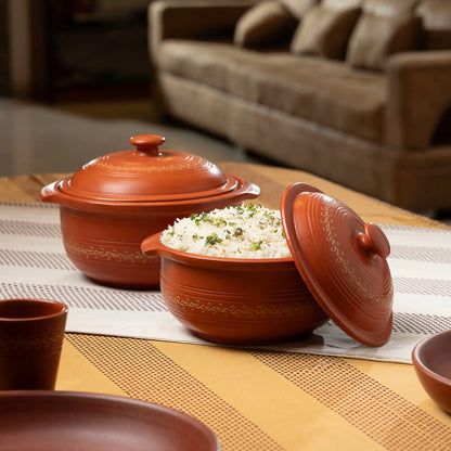 Terracotta serving pot with lid used to serve rice on dining table