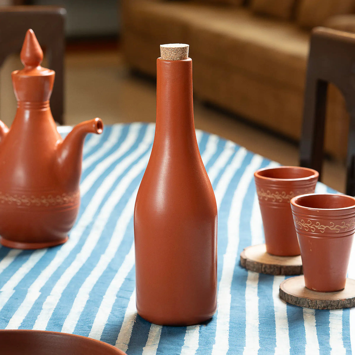 Terra Majlis handmade terracotta water bottle 700 ml with cork lid in dining setting