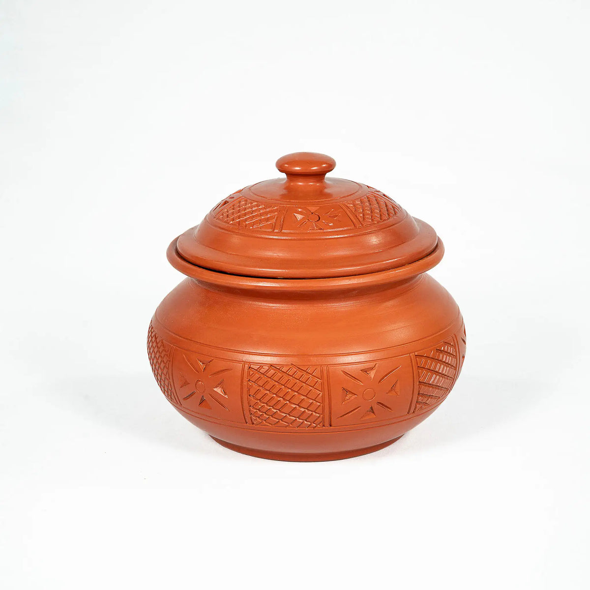 Carved terracotta serving pot with lid in Terra Majlis collection