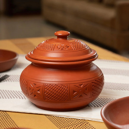 Handmade terracotta serving pot with carved artisan detailing