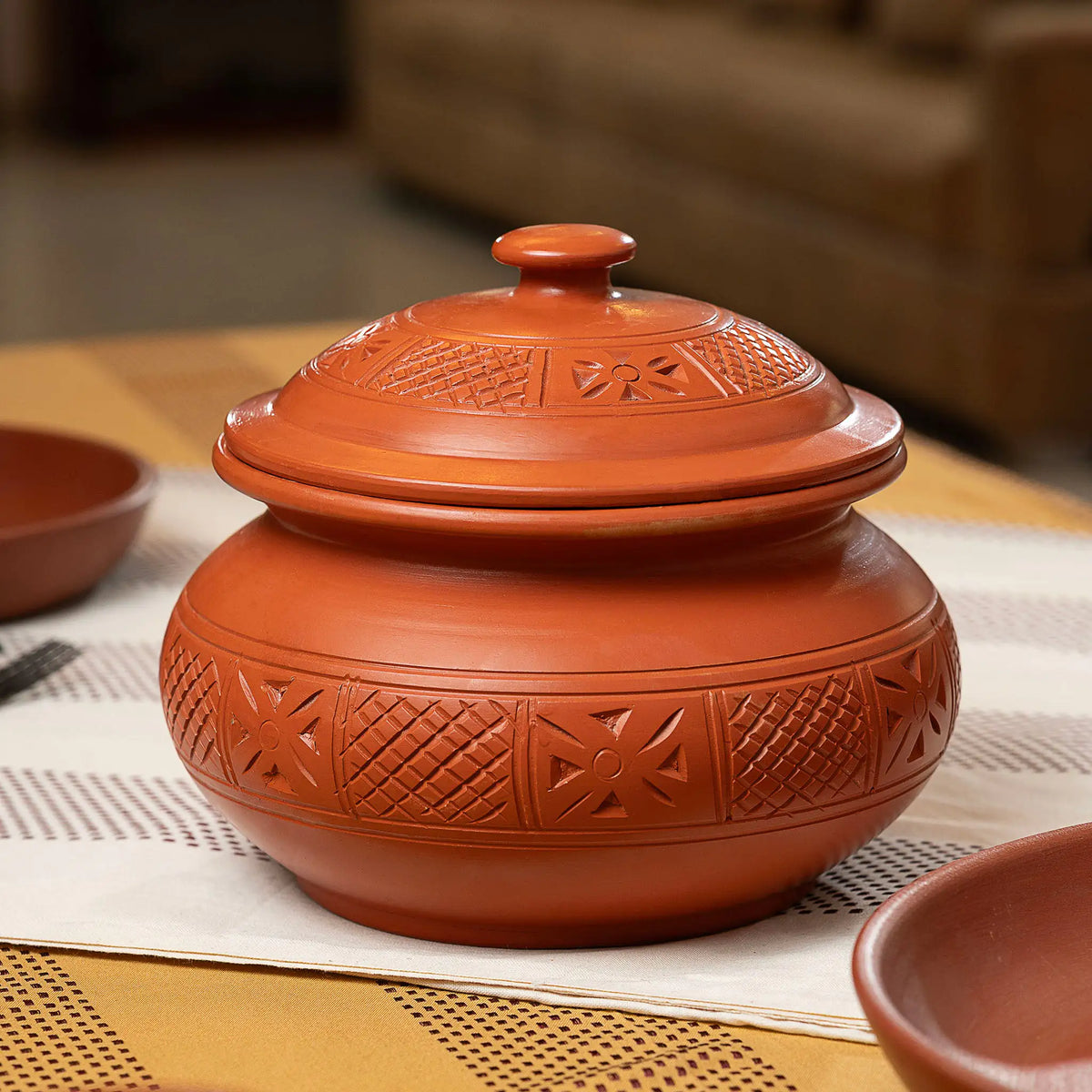 Carved lidded terracotta serving pot for rice curries and biryani