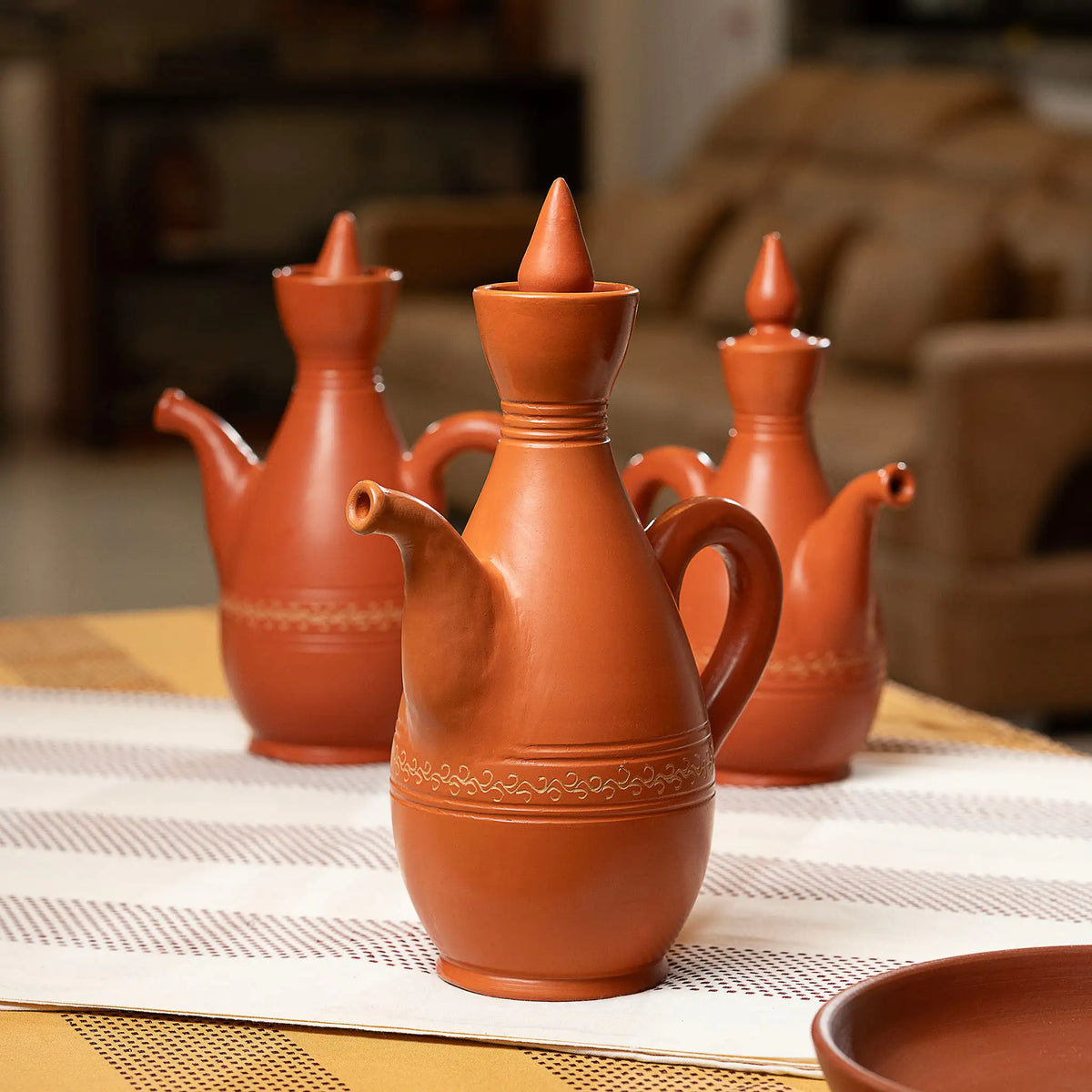 Terra Majlis terracotta serving jugs styled for dining and majlis hosting
