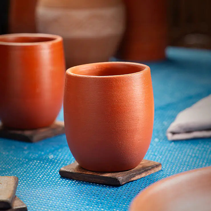 ClayRootz handmade terracotta Belly Glass 200–250 ml in lifestyle table setting