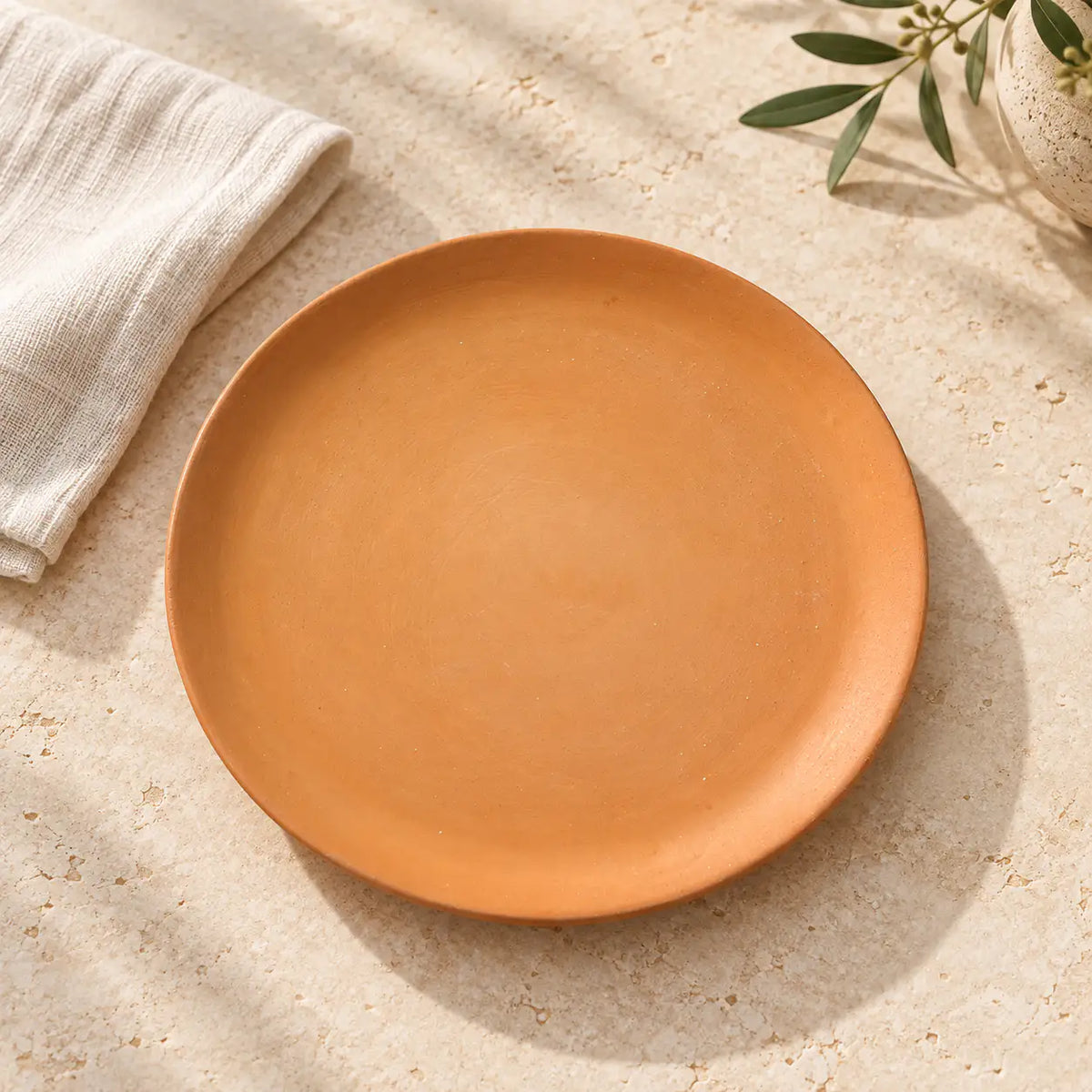 Terrapura handmade clay plate in natural lifestyle dining setting