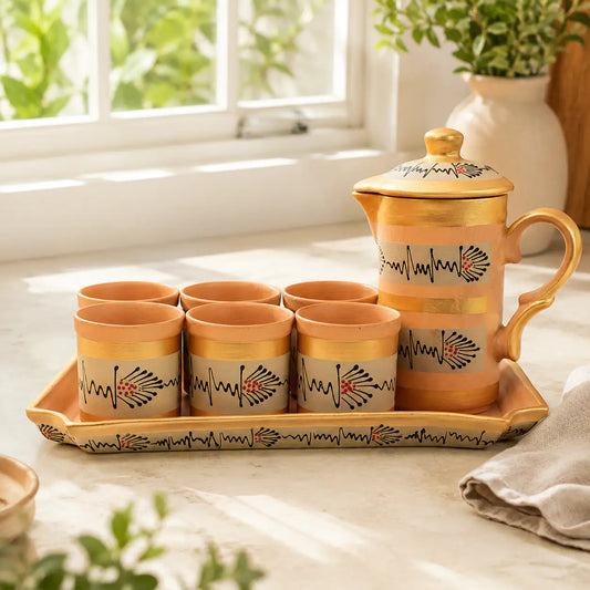 Beige hand-painted clay pitcher drinkware set by ARK Naturals