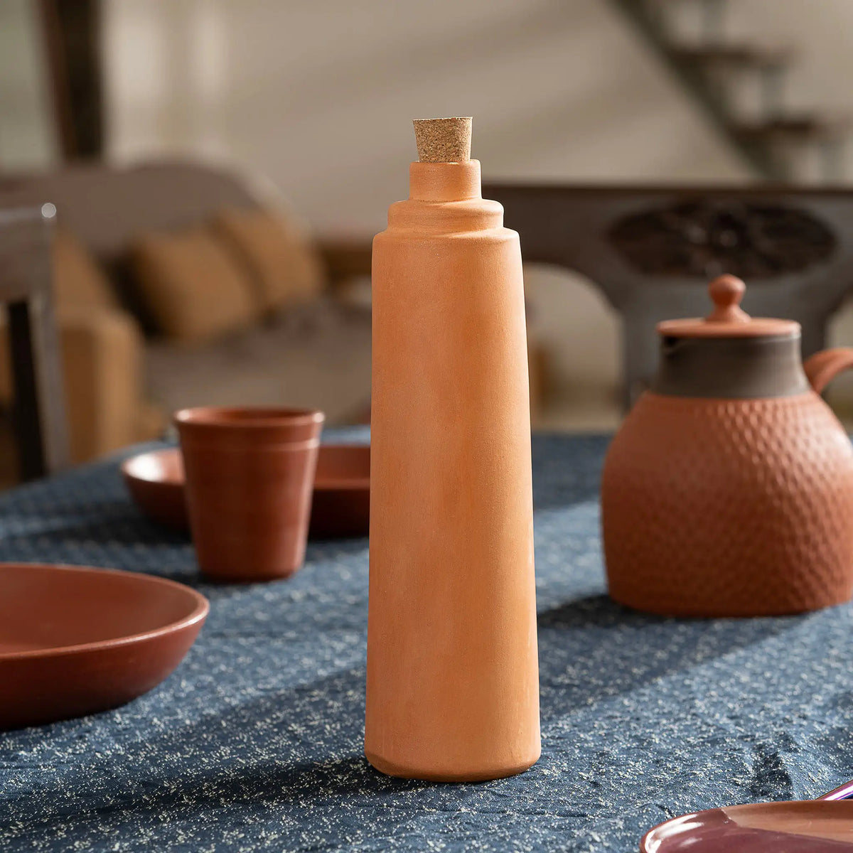 Terrapura 500 ml terracotta water bottle with cork in lifestyle setting