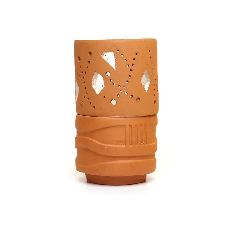 Terracotta tealight holder with diamond cutwork on white background